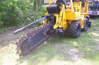 Riding trencher/backhoe