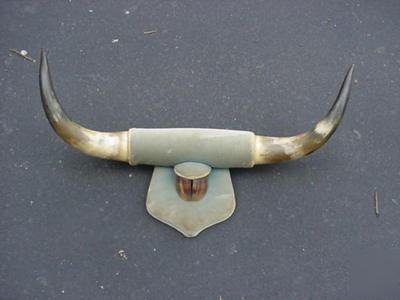 Mounted antique long horn with cloven hoof