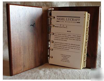 Compact organiser made from elm with leather catch