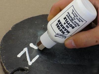 Metal marker in a bottle, white by nissen