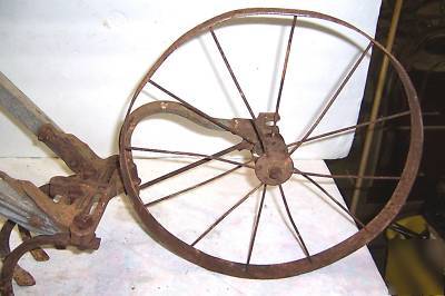 Vintage iron age hand garden wheel cultivator