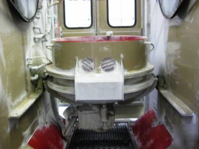 Rotofinish cenerifugal up-flow spin finisher
