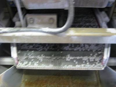 Rotofinish cenerifugal up-flow spin finisher