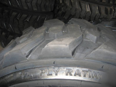 Set of (4) 12 x 16.5 (12 ply) skid steer / bobcat tires