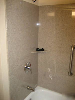 Solid granite bath surrounds--speckled grey