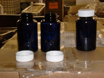 Clear blue bottles and white caps