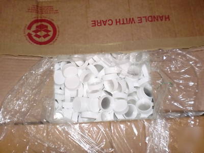 Clear blue bottles and white caps