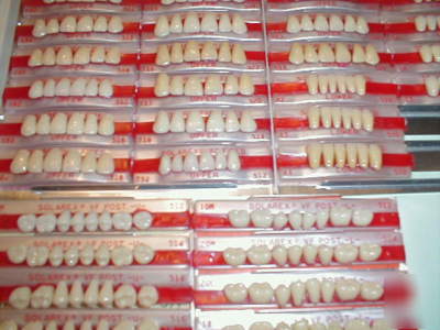 New large lot of porcelain denture teeth and carded