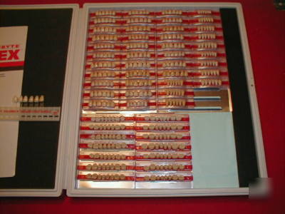 New large lot of porcelain denture teeth and carded