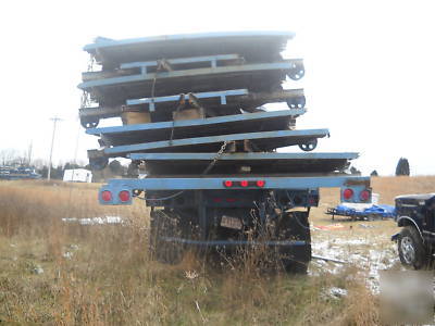 Tilt a whirl carnival ride on a semi trailer amusement