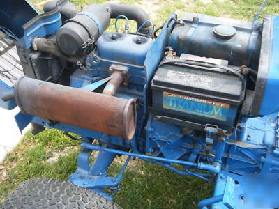 Ford 1100 diesel tractor 4X4 w/rear mower deck & plow.