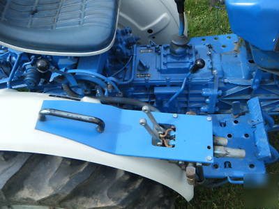 Ford 1100 diesel tractor 4X4 w/rear mower deck & plow.
