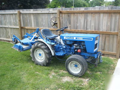 Ford 1100 diesel tractor 4X4 w/rear mower deck & plow.