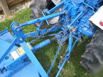 Ford 1100 diesel tractor 4X4 w/rear mower deck & plow.