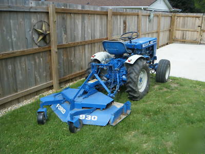 Ford 1100 diesel tractor 4X4 w/rear mower deck & plow.
