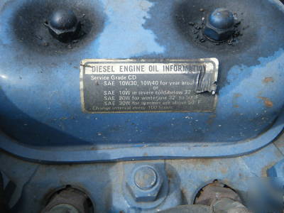 Ford 1100 diesel tractor 4X4 w/rear mower deck & plow.