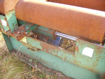 Lumber conveyor, powered feed rollers