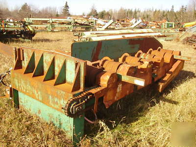 Lumber conveyor, powered feed rollers