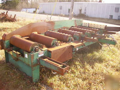 Lumber conveyor, powered feed rollers