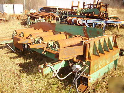 Lumber conveyor, powered feed rollers