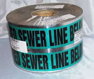 Caution sewer line buried below warning 6'' tape